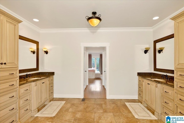 bathroom with vanity and ornamental molding