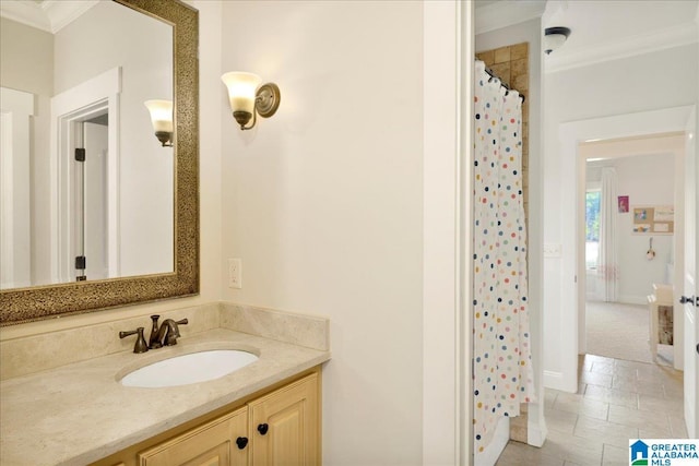 bathroom with crown molding, vanity, and curtained shower