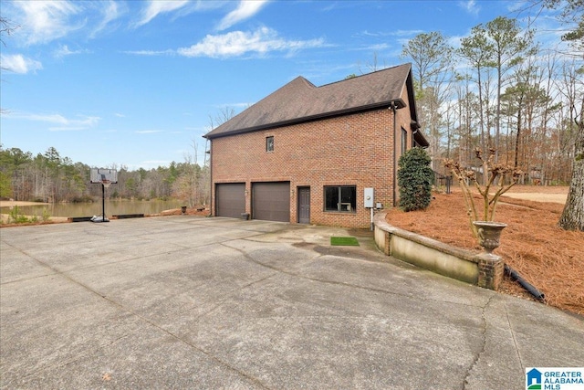 view of side of property with a garage