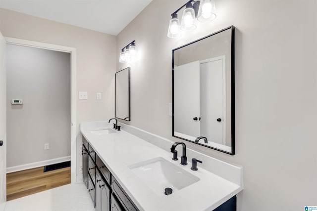 bathroom with vanity and wood-type flooring