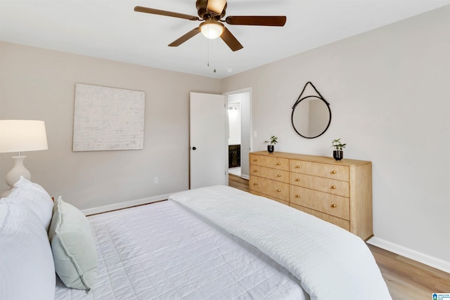 bedroom with ceiling fan and light wood-type flooring