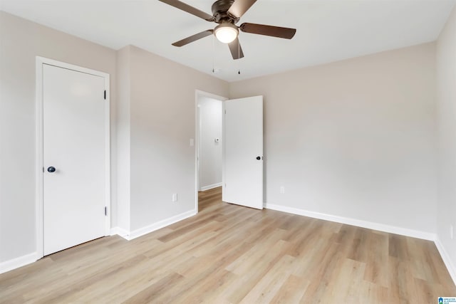 unfurnished bedroom featuring ceiling fan and light hardwood / wood-style floors