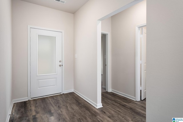 hallway with dark hardwood / wood-style flooring