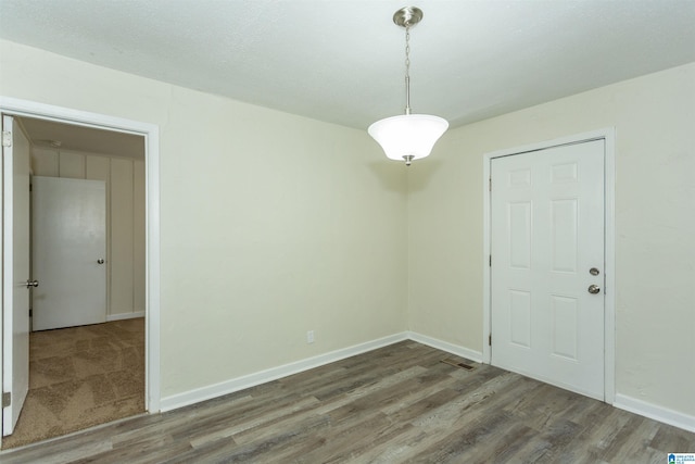 unfurnished room featuring hardwood / wood-style floors