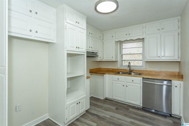 kitchen featuring dishwasher, wood-type flooring, sink, white cabinets, and wooden counters