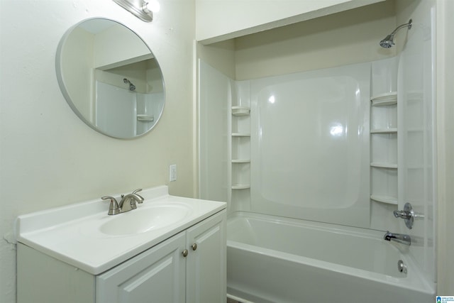 bathroom featuring vanity and  shower combination