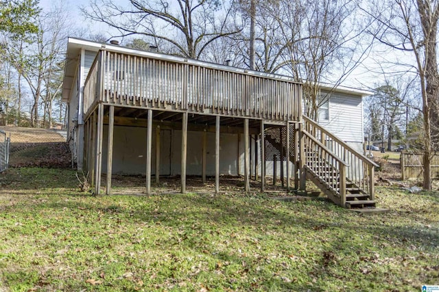 back of property featuring a yard and a deck