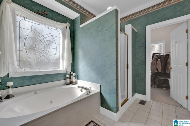 bathroom with tile patterned flooring, crown molding, and plus walk in shower