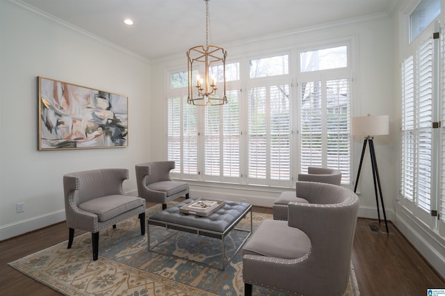 living area featuring ornamental molding, dark hardwood / wood-style floors, and a notable chandelier