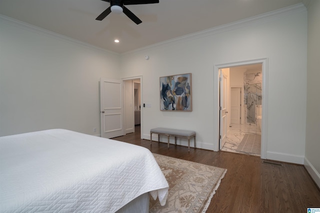 bedroom featuring connected bathroom, dark wood-type flooring, ornamental molding, and ceiling fan