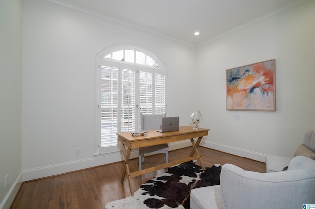 office space featuring hardwood / wood-style flooring, ornamental molding, and a wealth of natural light