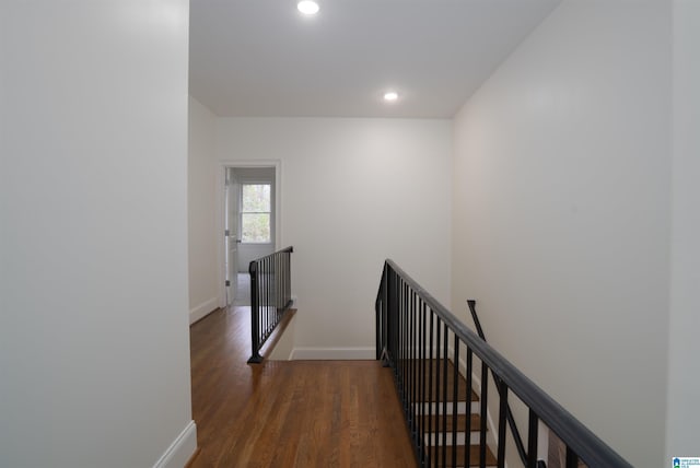 corridor featuring dark hardwood / wood-style floors