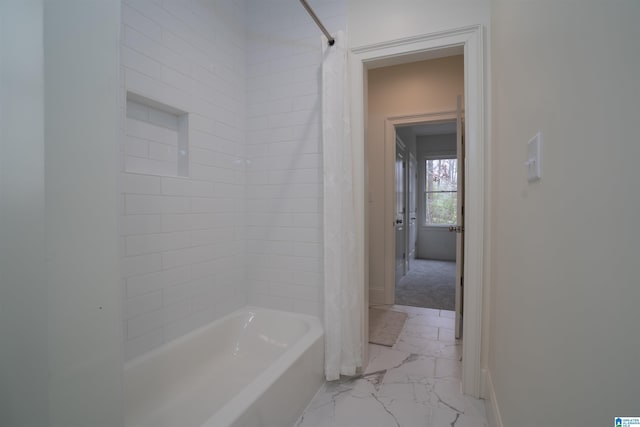 bathroom featuring shower / bath combo with shower curtain