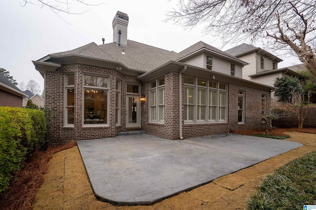 back of property with a patio area