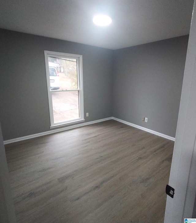 empty room featuring dark hardwood / wood-style floors