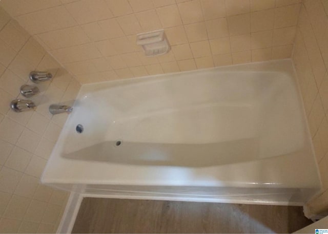 bathroom featuring a tub to relax in