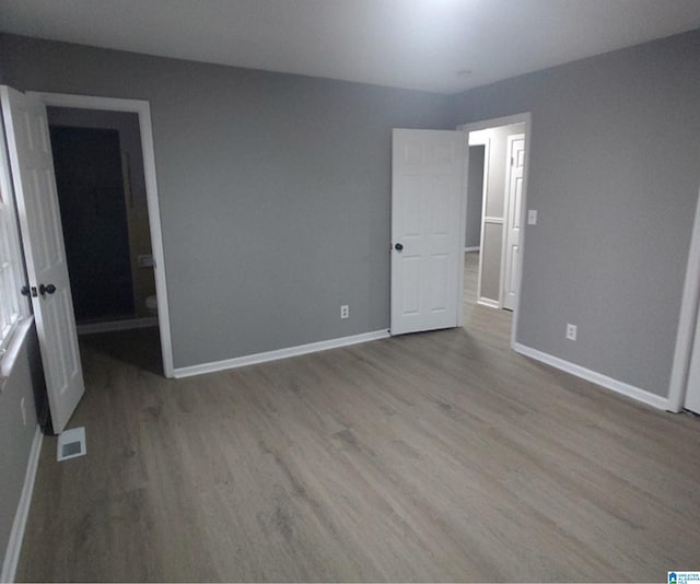 unfurnished bedroom featuring light wood-type flooring