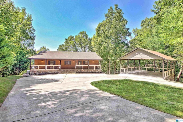 view of front of property with a gazebo, a front yard, and covered porch