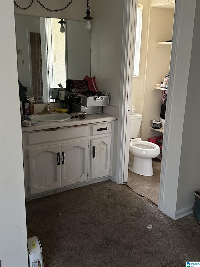 bathroom featuring vanity and toilet