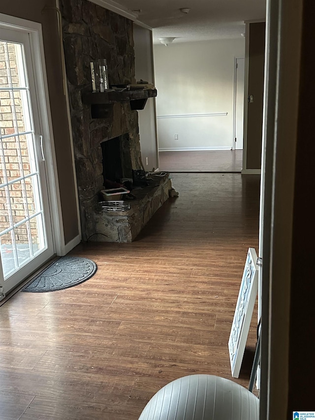 hall with hardwood / wood-style floors