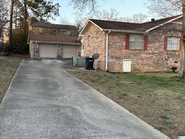 view of property exterior featuring a garage, a yard, and central AC unit