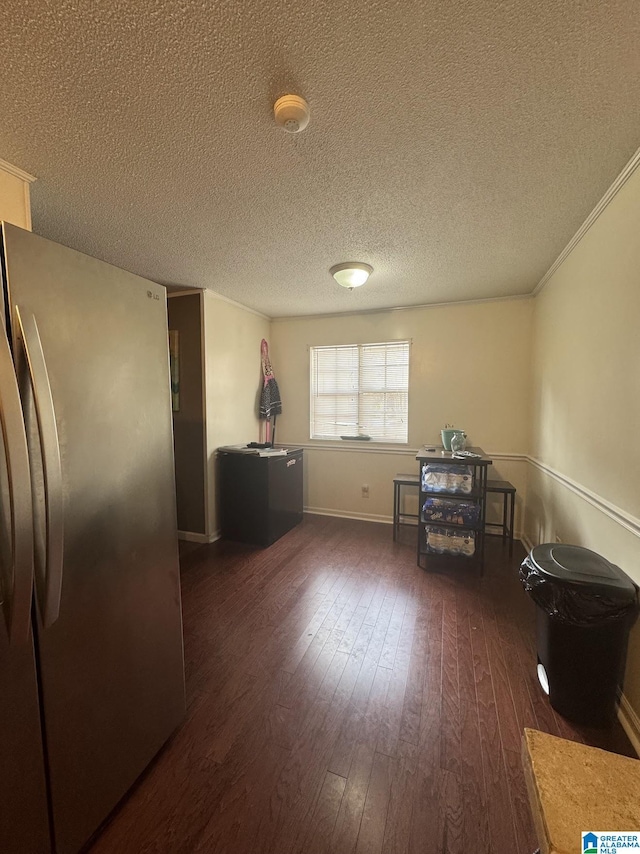 miscellaneous room featuring crown molding, a textured ceiling, and dark hardwood / wood-style flooring