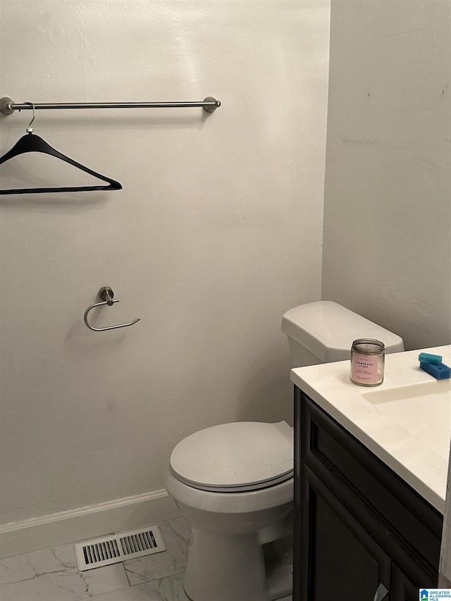 bathroom with vanity and toilet