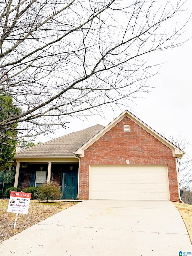 view of front of property with a garage