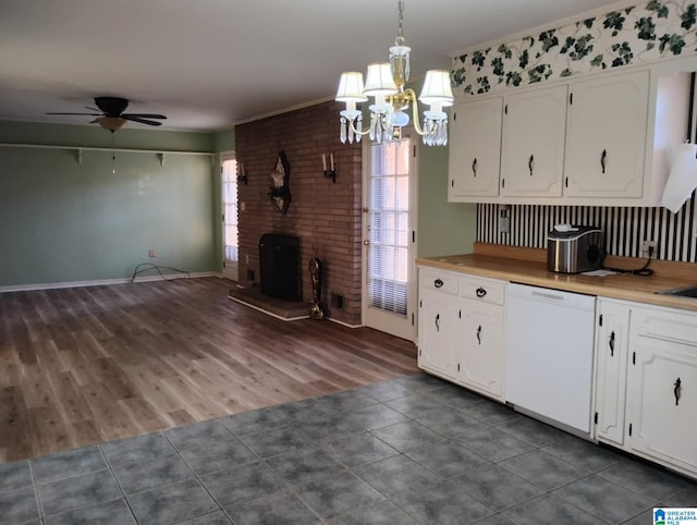 kitchen featuring white cabinetry, light countertops, dishwasher, and ceiling fan with notable chandelier