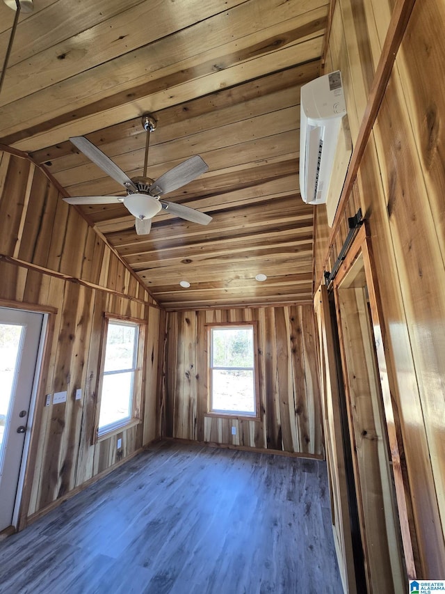 misc room with vaulted ceiling, dark hardwood / wood-style flooring, ceiling fan, a barn door, and wooden ceiling