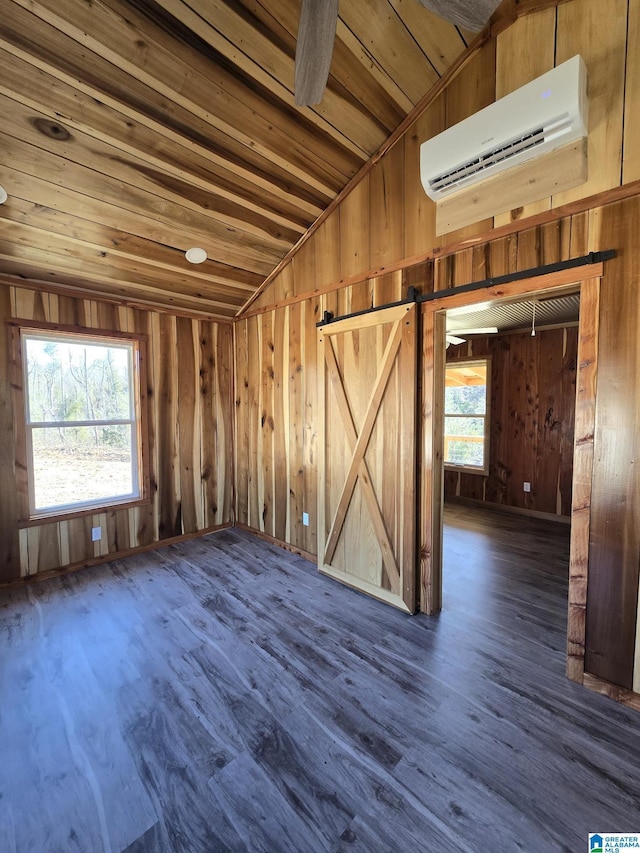 unfurnished room featuring dark wood-type flooring, lofted ceiling, wooden ceiling, wooden walls, and a wall unit AC