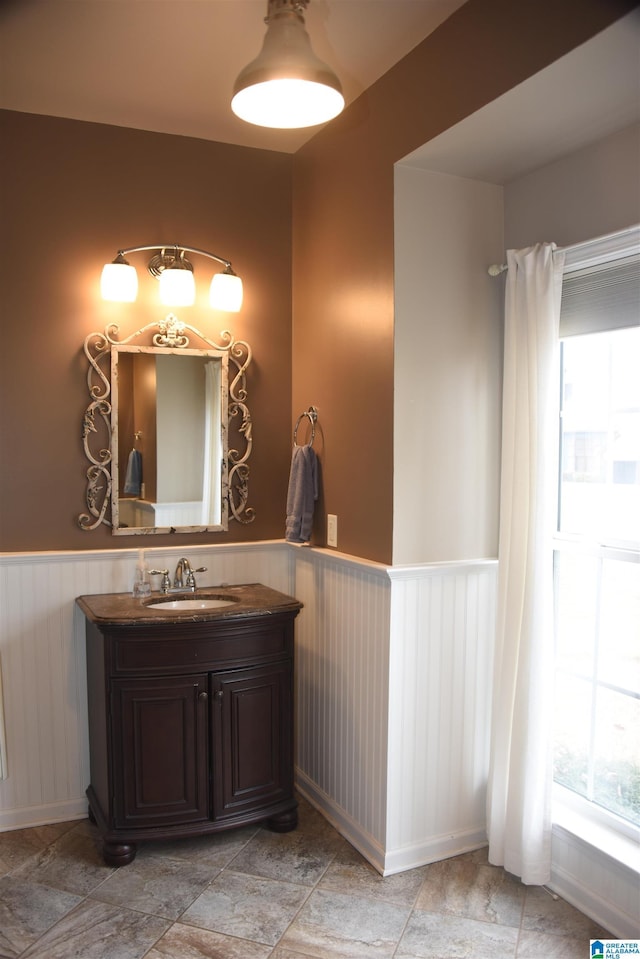 bathroom featuring wainscoting and vanity