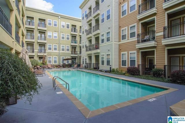 view of swimming pool with a patio