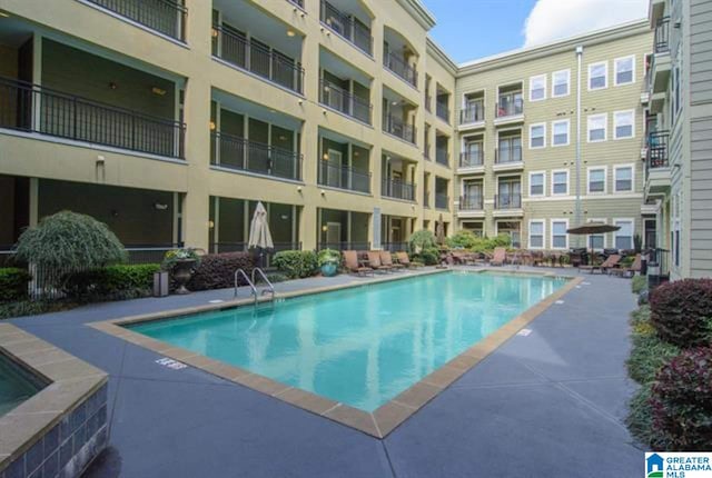 view of swimming pool with a patio