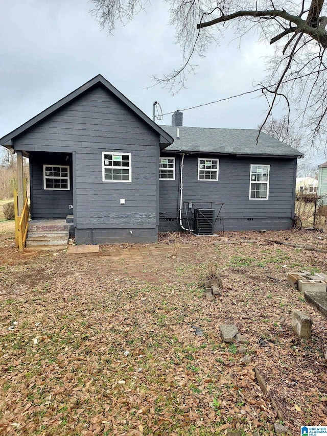 rear view of house featuring cooling unit