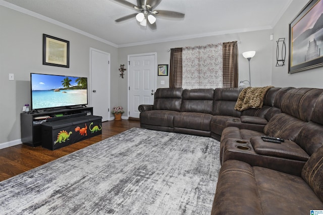 living room with dark hardwood / wood-style flooring, ornamental molding, and ceiling fan