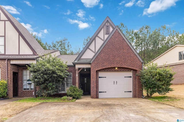 tudor home featuring a garage