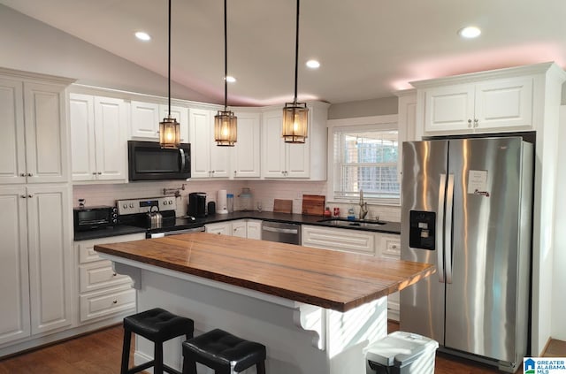 kitchen with stainless steel appliances, sink, and white cabinets