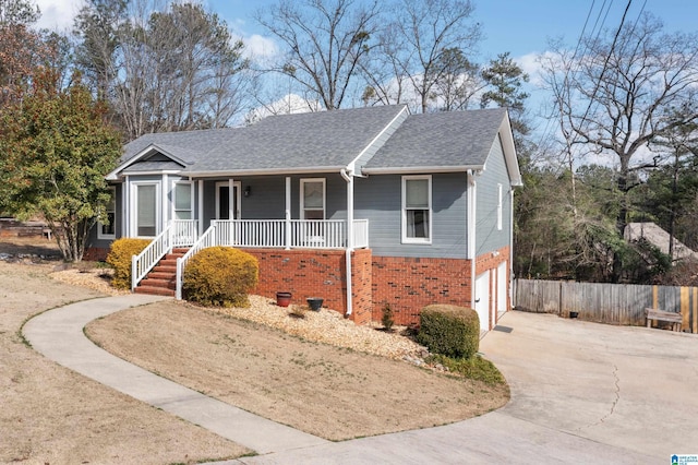 view of front of house with a porch and a garage