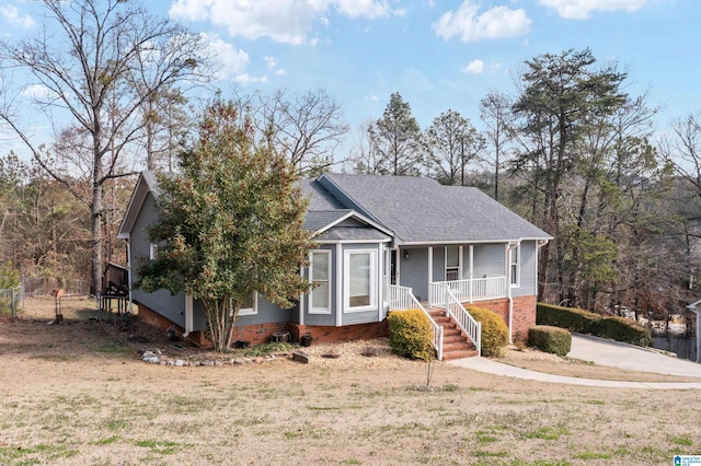 view of front facade featuring a front lawn and covered porch