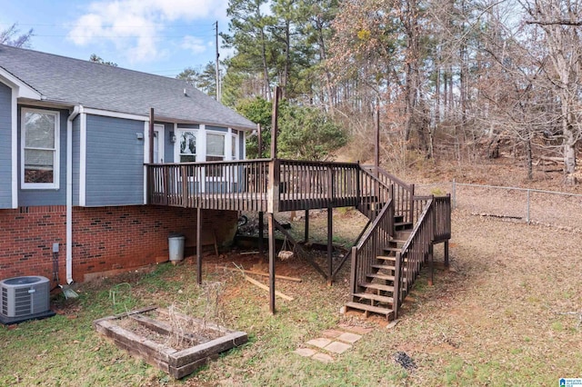 view of yard featuring central AC and a deck