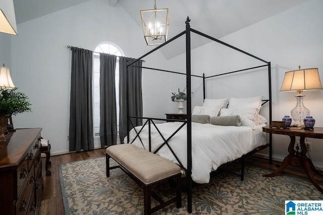 bedroom featuring wood-type flooring, a chandelier, and high vaulted ceiling