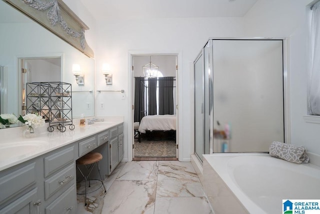 bathroom with vanity and separate shower and tub