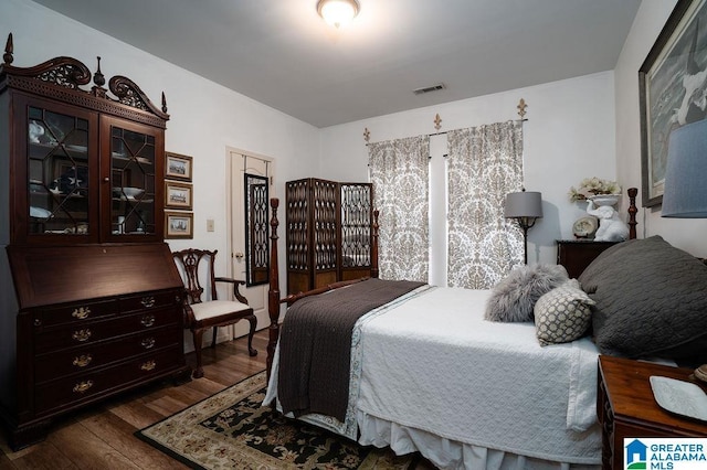 bedroom featuring dark hardwood / wood-style flooring