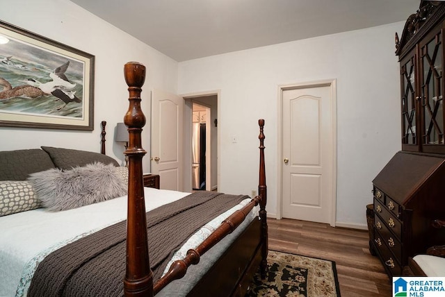 bedroom featuring dark hardwood / wood-style flooring