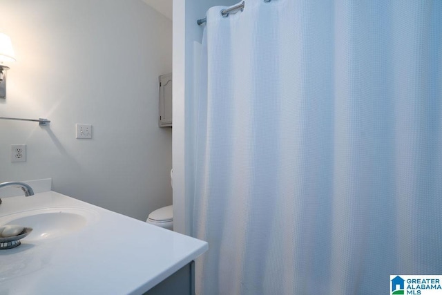 bathroom featuring vanity and toilet