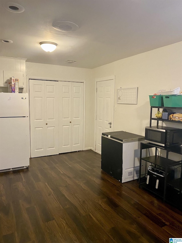 interior space with dark wood-type flooring