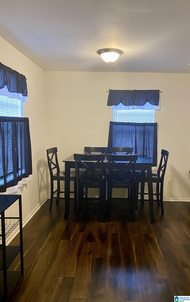 dining area featuring dark hardwood / wood-style flooring