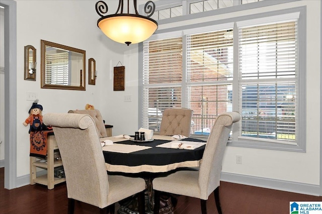 dining area with dark hardwood / wood-style floors