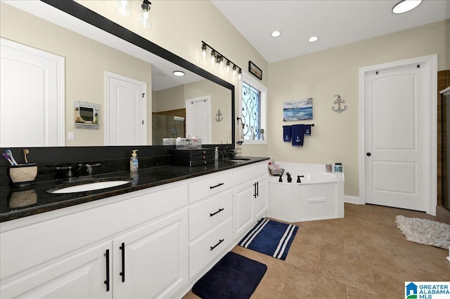 bathroom featuring vanity and separate shower and tub